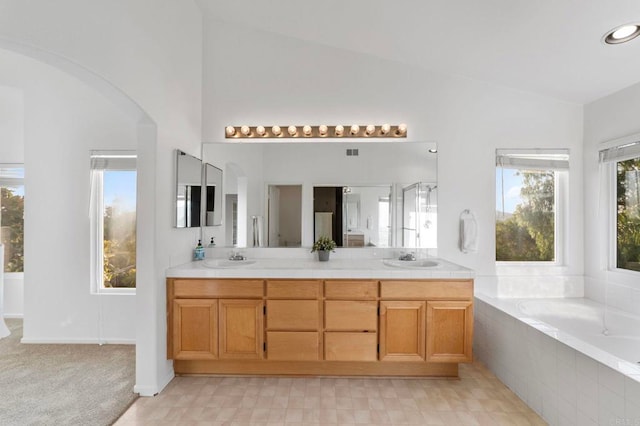 13756 Fontanelle Pl, San Diego, CA 92128 - full bath with vaulted ceiling, a bath, and double vanity