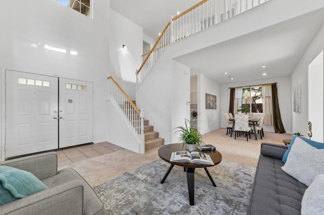 13756 Fontanelle Pl, San Diego, CA 92128 - carpeted living room featuring stairs, a towering ceiling, and tile patterned floors
