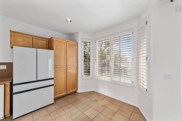 13756 Fontanelle Pl, San Diego, CA 92128 - kitchen with freestanding refrigerator, light tile patterned flooring, and recessed lighting