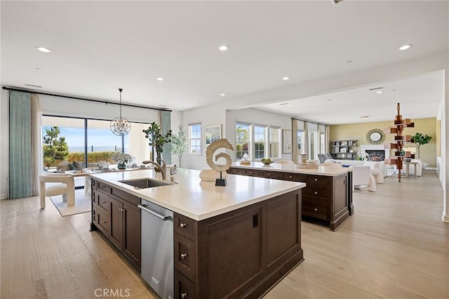 19818 Cornell Ln, Yorba Linda, CA 92886 - kitchen featuring stainless steel dishwasher, a kitchen island with sink, dark brown cabinetry, and recessed lighting