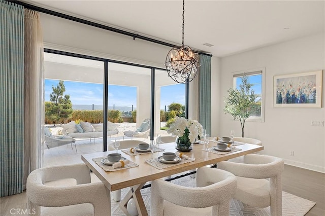 19818 Cornell Ln, Yorba Linda, CA 92886 - dining area featuring a chandelier and wood finished floors