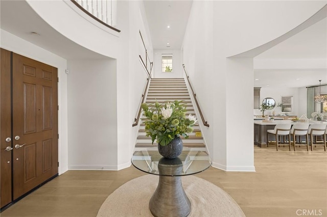 19818 Cornell Ln, Yorba Linda, CA 92886 - foyer entrance featuring stairs, wood finished floors, a towering ceiling, and recessed lighting