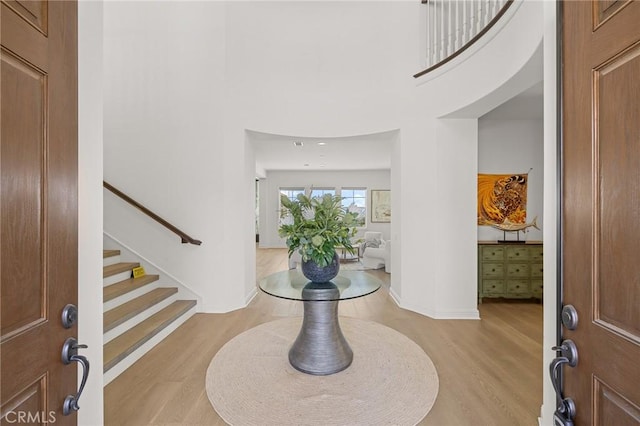 19818 Cornell Ln, Yorba Linda, CA 92886 - entryway featuring light wood-style flooring, stairway, and a high ceiling