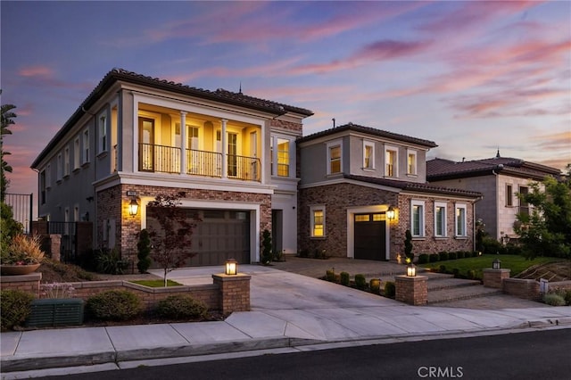 19818 Cornell Ln, Yorba Linda, CA 92886 - view of front of house with an attached garage, concrete driveway, stucco siding, and a balcony