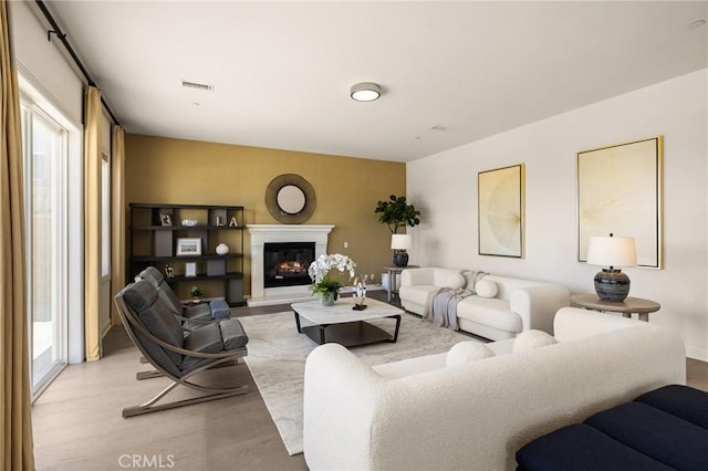 19818 Cornell Ln, Yorba Linda, CA 92886 - living area with light wood finished floors and a glass covered fireplace