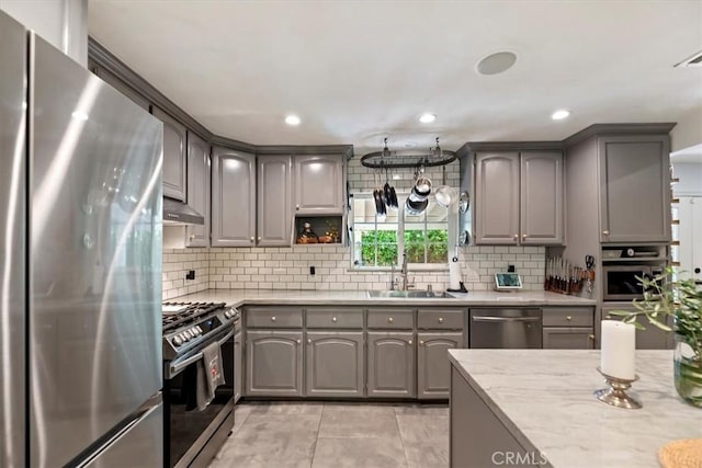 3751 Laurita Ave, Pasadena, CA 91107 - kitchen featuring stainless steel appliances, gray cabinetry, tasteful backsplash, light tile patterned flooring, and recessed lighting