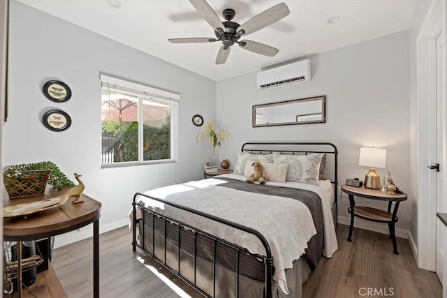 3751 Laurita Ave, Pasadena, CA 91107 - bedroom featuring a wall mounted air conditioner, wood finished floors, and ceiling fan