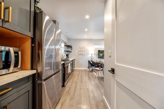 3751 Laurita Ave, Pasadena, CA 91107 - kitchen featuring appliances with stainless steel finishes, light wood-style floors, and recessed lighting