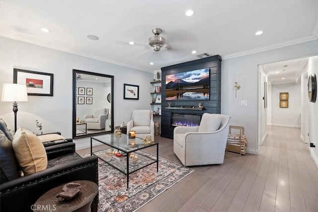3751 Laurita Ave, Pasadena, CA 91107 - living area featuring a ceiling fan, recessed lighting, wood finished floors, crown molding, and a glass covered fireplace