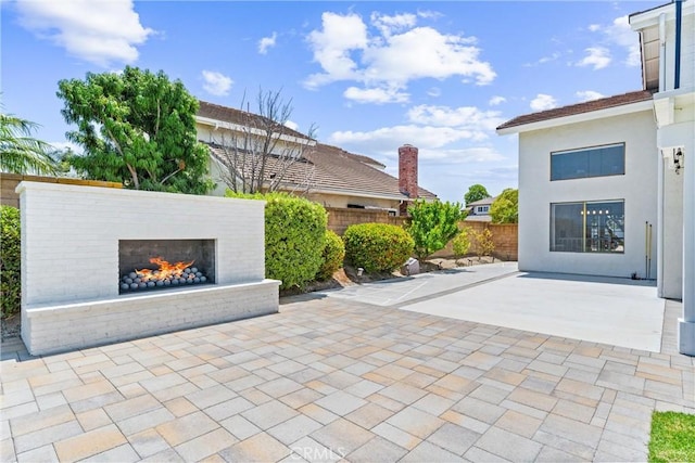 28422 La Pradera, Laguna Niguel, CA 92677 - fenced backyard with an outdoor brick fireplace and a patio