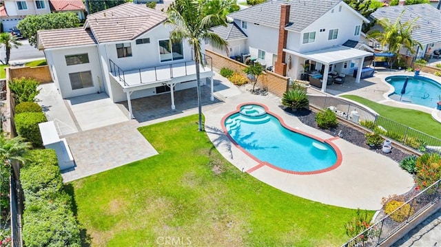 28422 La Pradera, Laguna Niguel, CA 92677 - rear view of house with a fenced backyard, a patio, stucco siding, a pool with connected hot tub, and a balcony