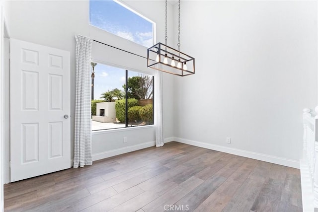 28422 La Pradera, Laguna Niguel, CA 92677 - unfurnished dining area featuring a chandelier and wood finished floors