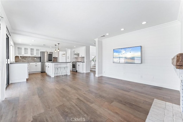 28422 La Pradera, Laguna Niguel, CA 92677 - unfurnished living room featuring ornamental molding, dark wood-style floors, and recessed lighting