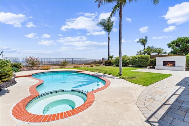 28422 La Pradera, Laguna Niguel, CA 92677 - view of pool featuring a warm lit fireplace, a patio, and a pool with connected hot tub