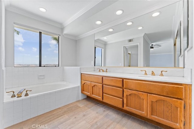 28422 La Pradera, Laguna Niguel, CA 92677 - bathroom featuring double vanity, plenty of natural light, a bath, crown molding, and wood finished floors