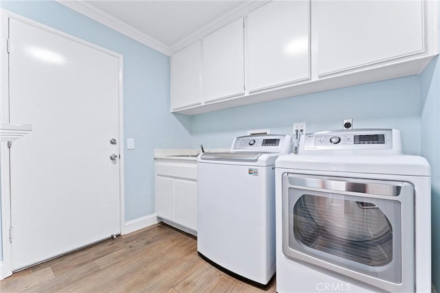 28422 La Pradera, Laguna Niguel, CA 92677 - washroom featuring ornamental molding, washing machine and dryer, light wood-style floors, and cabinet space
