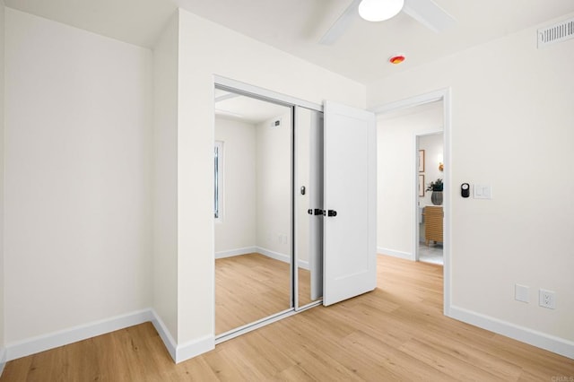 1481 Camino Linda Dr, San Marcos, CA 92078 - unfurnished bedroom featuring light wood-style flooring, a closet, and a ceiling fan