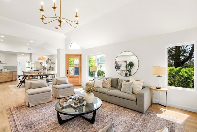 1481 Camino Linda Dr, San Marcos, CA 92078 - living area with light wood finished floors, a chandelier, and lofted ceiling