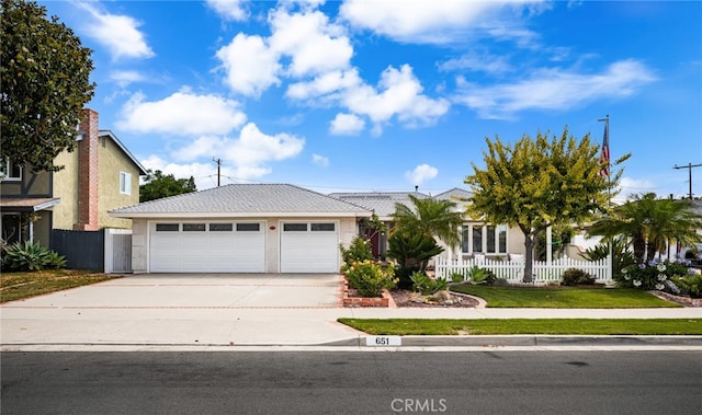 651 Lemke Dr, Placentia, CA 92870 - view of front of home featuring concrete driveway, an attached garage, and stucco siding