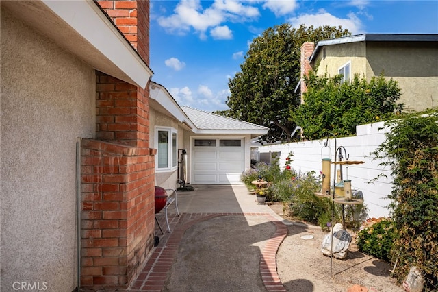 651 Lemke Dr, Placentia, CA 92870 - view of property exterior with stucco siding, brick siding, a garage, and driveway