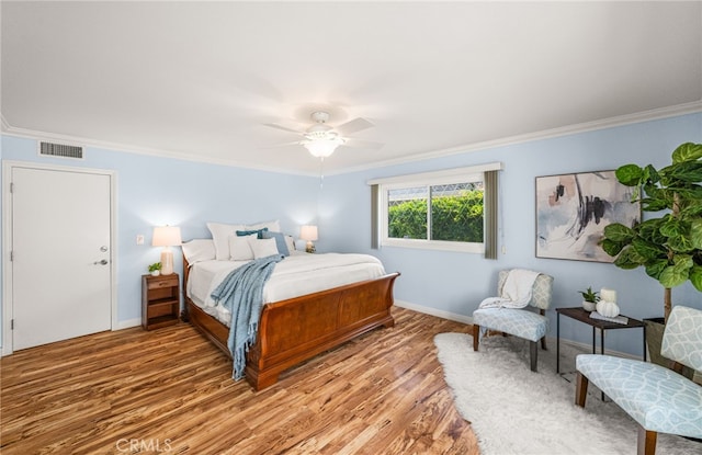 651 Lemke Dr, Placentia, CA 92870 - bedroom with crown molding, light wood-style floors, and a ceiling fan