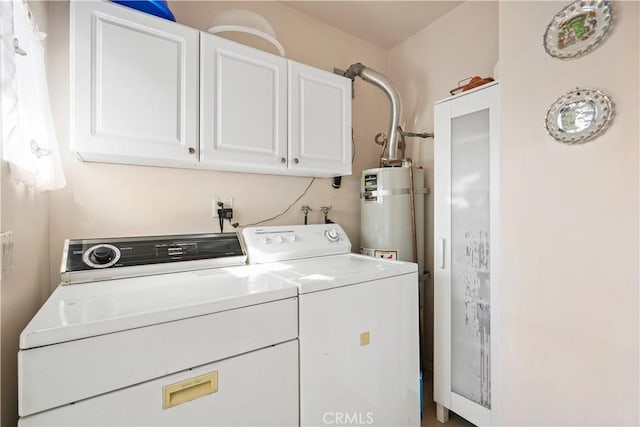 56665672 Franklin Ave, Los Angeles, CA 90028 - laundry room with washer and clothes dryer, strapped water heater, and cabinet space