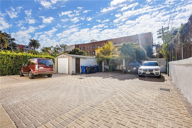 56665672 Franklin Ave, Los Angeles, CA 90028 - view of car parking featuring a garage and driveway