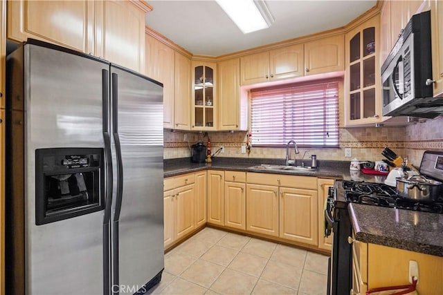 56665672 Franklin Ave, Los Angeles, CA 90028 - kitchen with stainless steel appliances, light brown cabinets, light tile patterned floors, and decorative backsplash