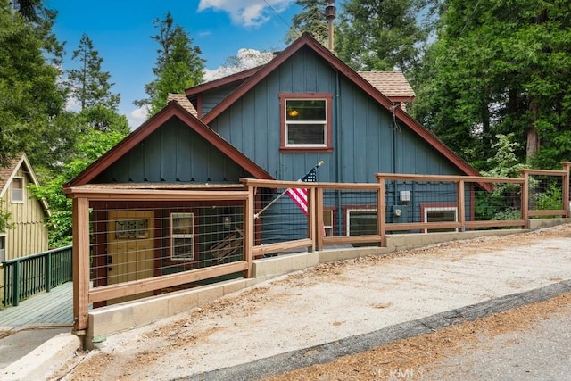 717 Crest Estates Dr, Lake Arrowhead, CA 92352 - rustic home featuring board and batten siding and roof with shingles