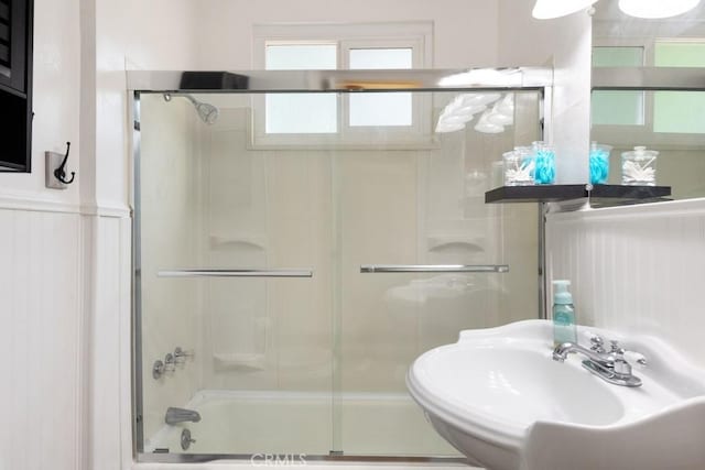 717 Crest Estates Dr, Lake Arrowhead, CA 92352 - full bathroom featuring a sink and bath / shower combo with glass door