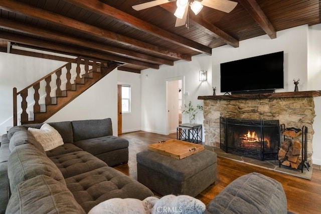 717 Crest Estates Dr, Lake Arrowhead, CA 92352 - living area featuring a wooden ceiling with exposed beams, wood finished floors, a stone fireplace, ceiling fan, and stairs