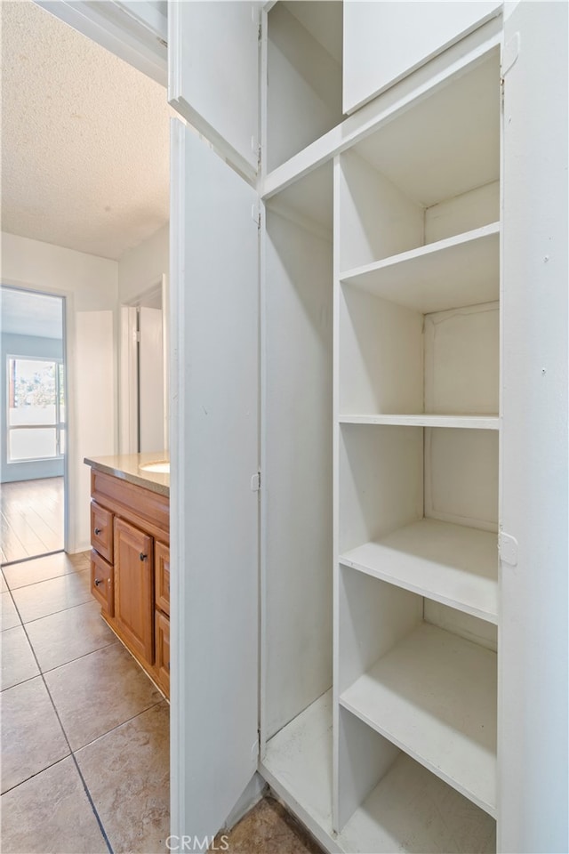 5585 E Pacific Coast Unit 144, Long Beach, CA 90804 - walk in closet with light tile patterned floors