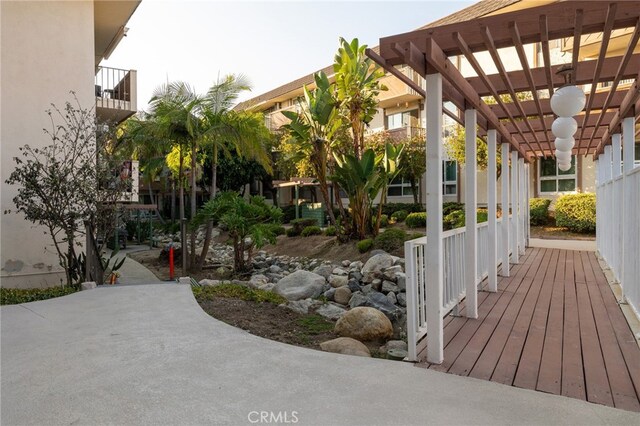 5585 E Pacific Coast Unit 144, Long Beach, CA 90804 - wooden deck with a pergola