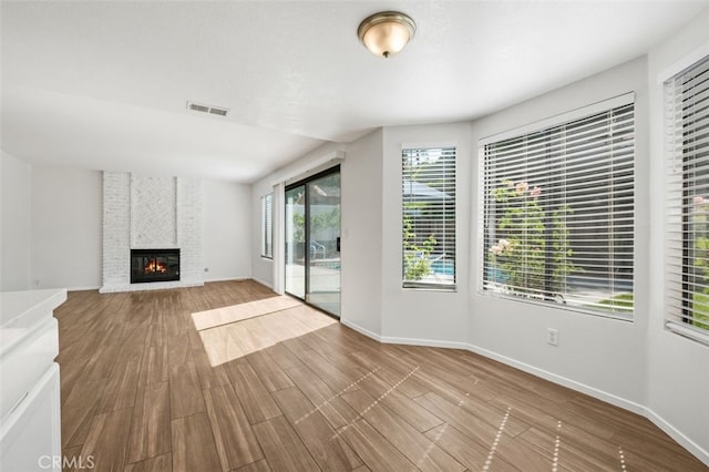 28611 Avenida Del Caballo, Laguna Niguel, CA 92677 - unfurnished living room featuring wood finished floors and a fireplace
