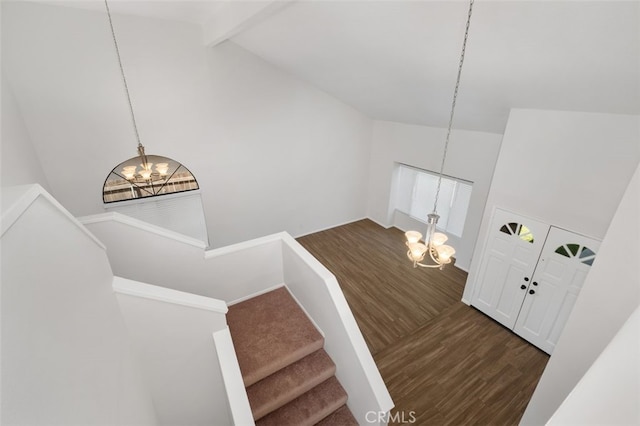 28611 Avenida Del Caballo, Laguna Niguel, CA 92677 - stairway featuring a chandelier, wood finished floors, beam ceiling, and high vaulted ceiling