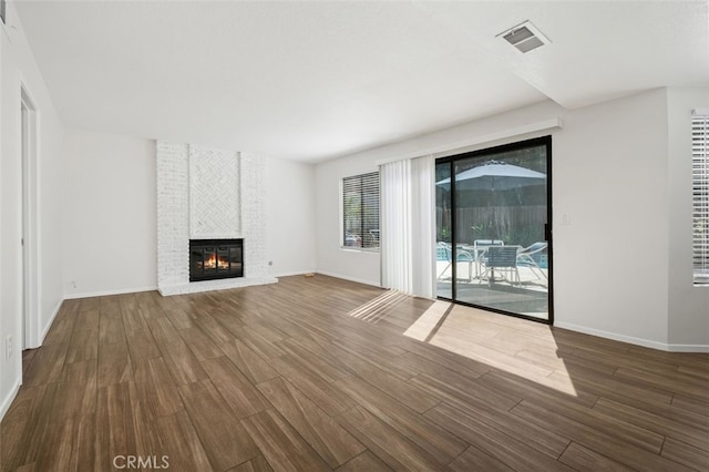 28611 Avenida Del Caballo, Laguna Niguel, CA 92677 - unfurnished living room featuring wood finished floors and a fireplace