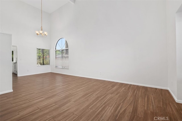 28611 Avenida Del Caballo, Laguna Niguel, CA 92677 - unfurnished room with wood finished floors, a chandelier, and high vaulted ceiling