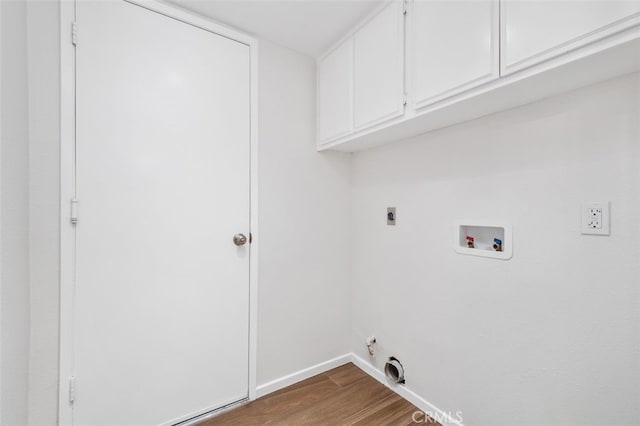 28611 Avenida Del Caballo, Laguna Niguel, CA 92677 - laundry room featuring cabinet space, dark wood-style floors, hookup for a washing machine, hookup for an electric dryer, and gas dryer hookup