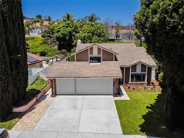 28611 Avenida Del Caballo, Laguna Niguel, CA 92677 - view of front of home featuring concrete driveway, a chimney, a tile roof, brick siding, and a garage