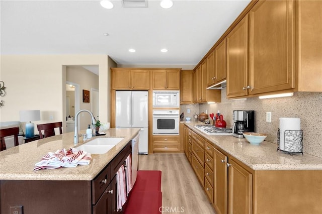 3667 Skylark Way, Brea, CA 92823 - kitchen featuring white appliances, light wood-style floors, light stone countertops, backsplash, and recessed lighting
