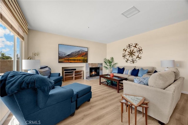 3667 Skylark Way, Brea, CA 92823 - living area with light wood-style floors and a tiled fireplace