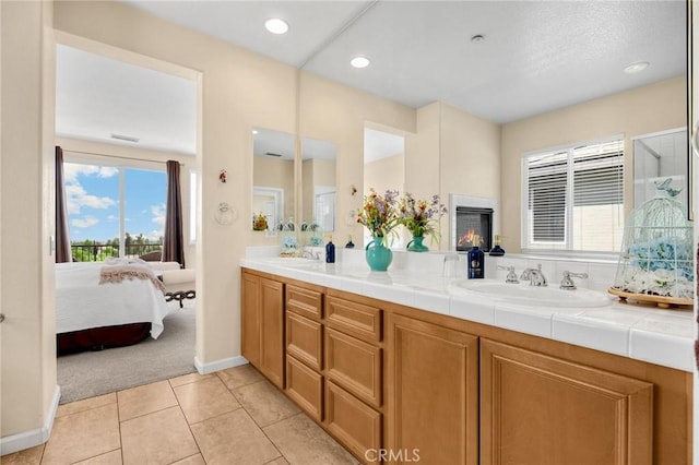 3667 Skylark Way, Brea, CA 92823 - full bath with double vanity, tile patterned floors, ensuite bathroom, and recessed lighting