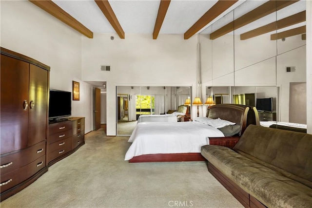 2700 Cahuenga Blvd E Unit 1302, Los Angeles, CA 90068 - carpeted bedroom featuring a towering ceiling and beamed ceiling