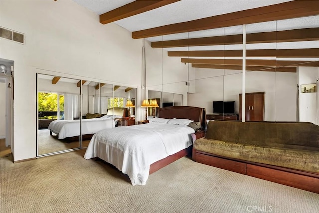 2700 Cahuenga Blvd E Unit 1302, Los Angeles, CA 90068 - bedroom featuring carpet floors, beam ceiling, and high vaulted ceiling