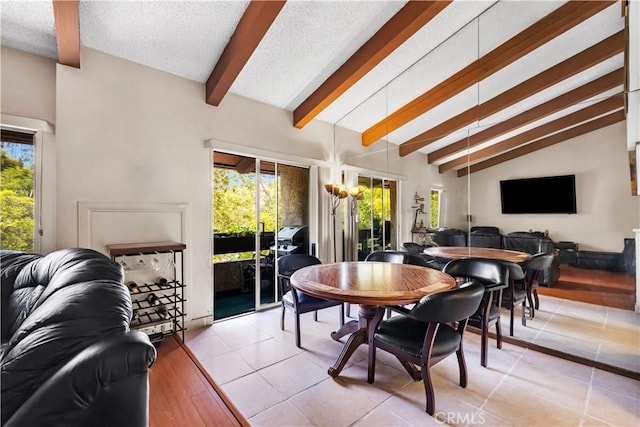 2700 Cahuenga Blvd E Unit 1302, Los Angeles, CA 90068 - dining room with healthy amount of natural light, a textured ceiling, and light tile patterned floors