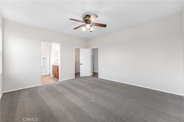 3150 James Ct, Lancaster, CA 93535 - unfurnished bedroom with a spacious closet, carpet, ensuite bath, a ceiling fan, and a closet