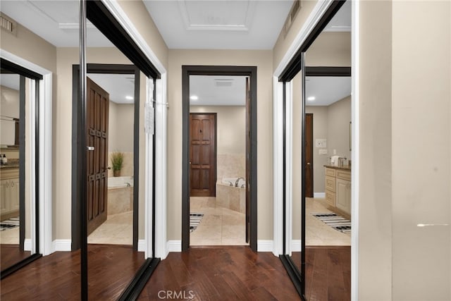 38225 Camino Sierra Rd, Temecula, CA 92592 - corridor with dark wood-type flooring and attic access