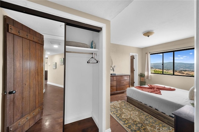 38225 Camino Sierra Rd, Temecula, CA 92592 - bedroom with dark wood-style flooring and a closet