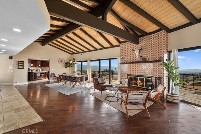 38225 Camino Sierra Rd, Temecula, CA 92592 - living room featuring a large fireplace, high vaulted ceiling, wood finished floors, and a wooden ceiling with exposed beams