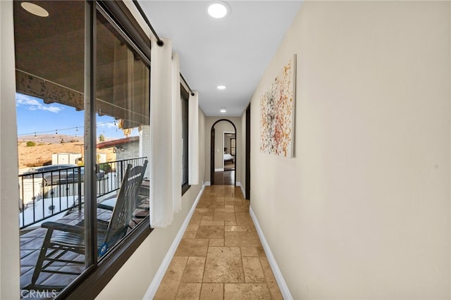 38225 Camino Sierra Rd, Temecula, CA 92592 - hall featuring stone tile flooring, arched walkways, and recessed lighting